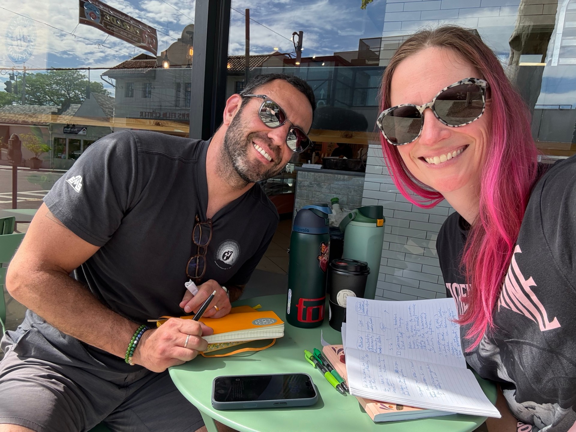 Kat and Tal at their first official Colibrí meeting, taking notes together